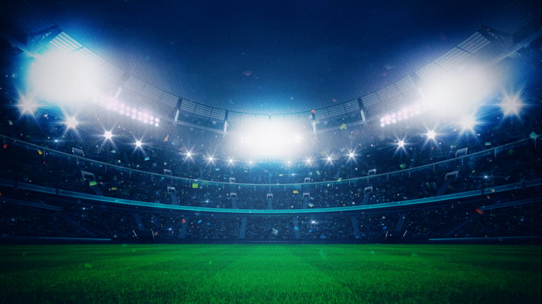 Ambiente de estadio nocturno ilustrando la emoción de las apuestas en Boomerang Bet